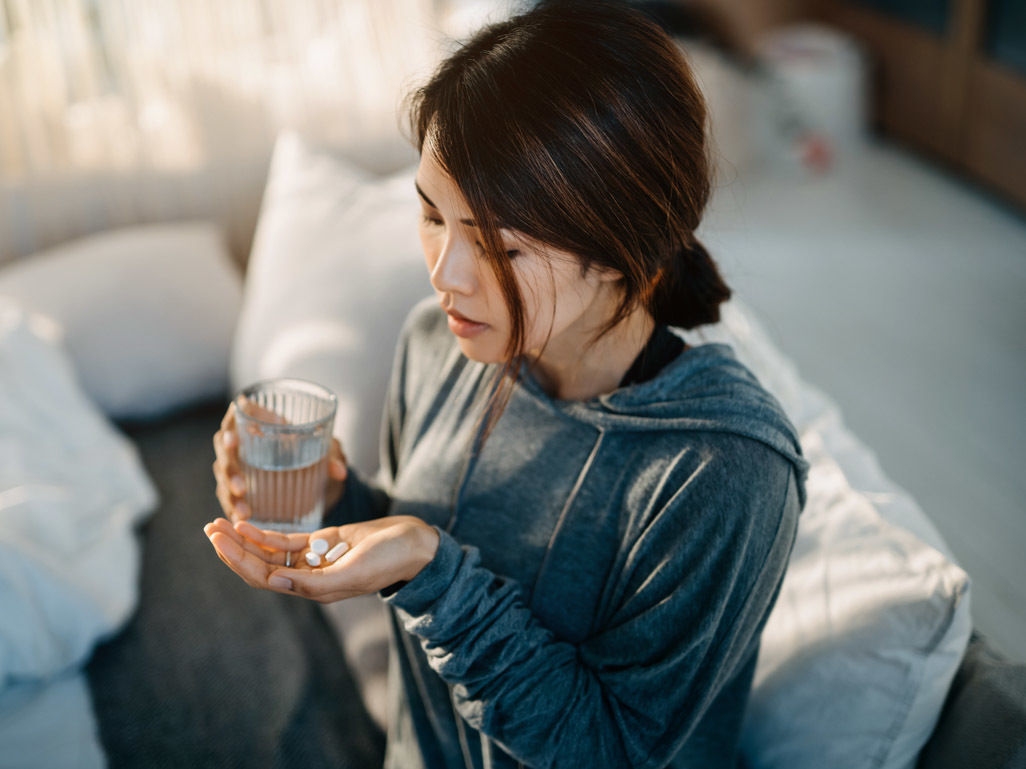 Woman taking medication