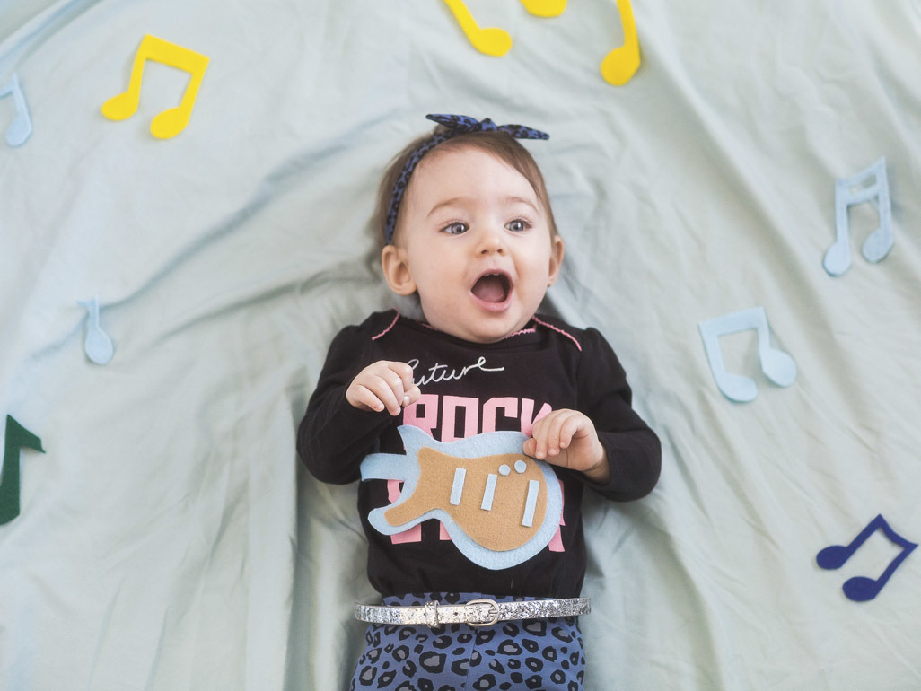 baby surrounded by music notes