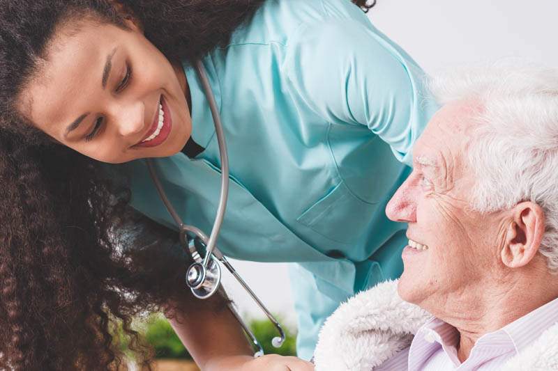 A nurse checking on her patient.