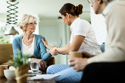 older person comforted by provider