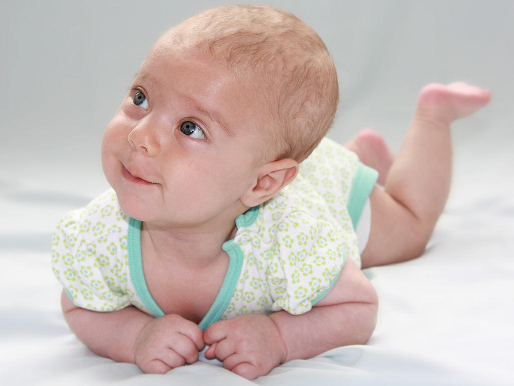 Baby lying on her tummy looking up