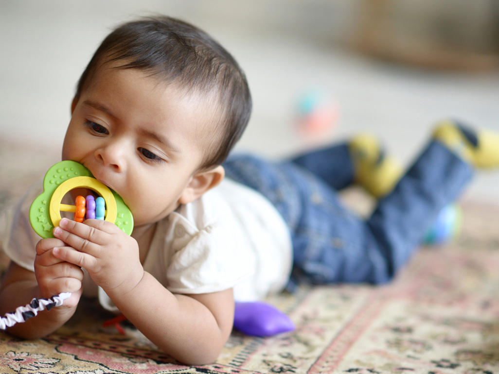 Baby biting on a teether