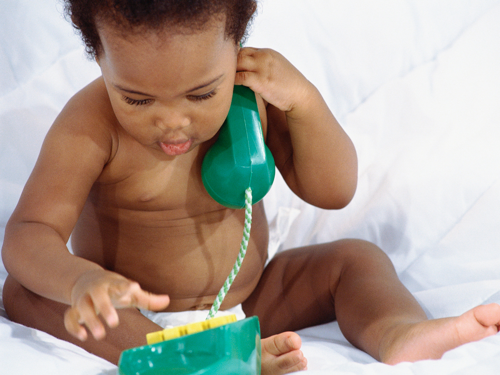 Baby playing with toy phone