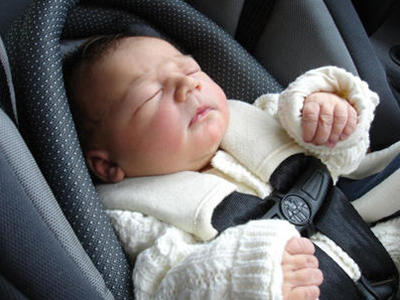 Newborn baby going home in car seat