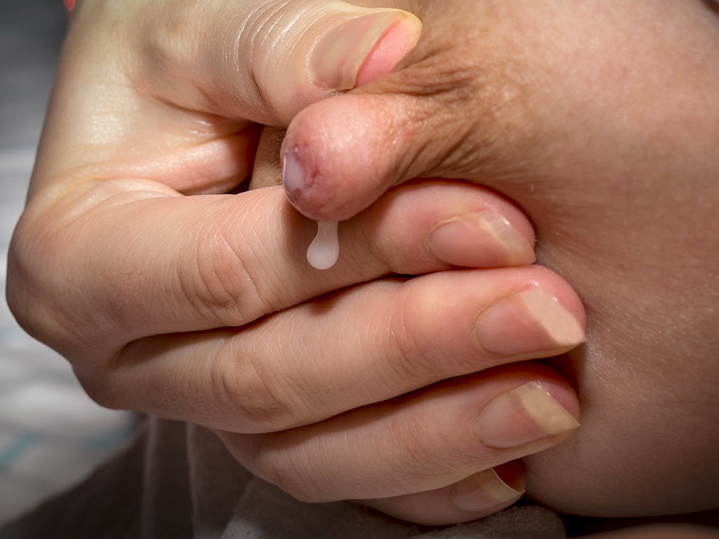 Mum hand expressing milk