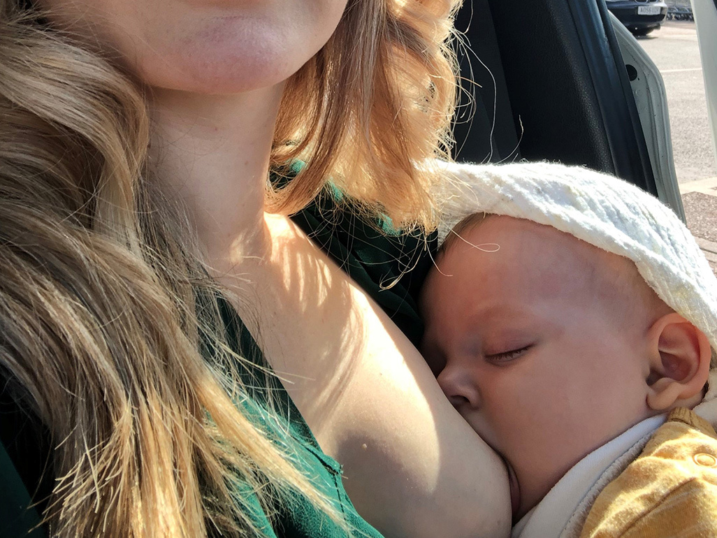 Mum breastfeeding baby boy