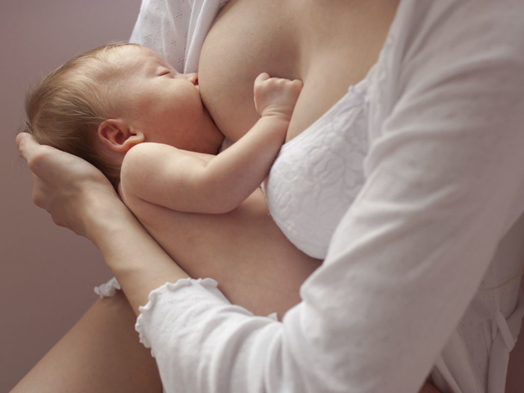 Newborn baby breastfeeding