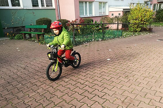 A child on a bicycle walk