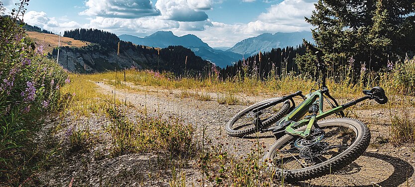 An e-bike on a gravel track at the Les Saisies station, in the French Alps