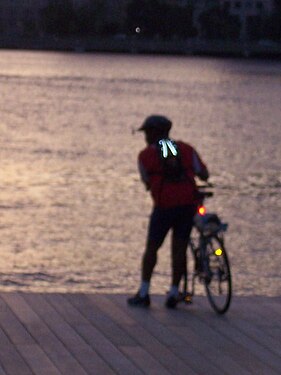 Biker on Fiedler Dock of Charles River Esplanade at sunset