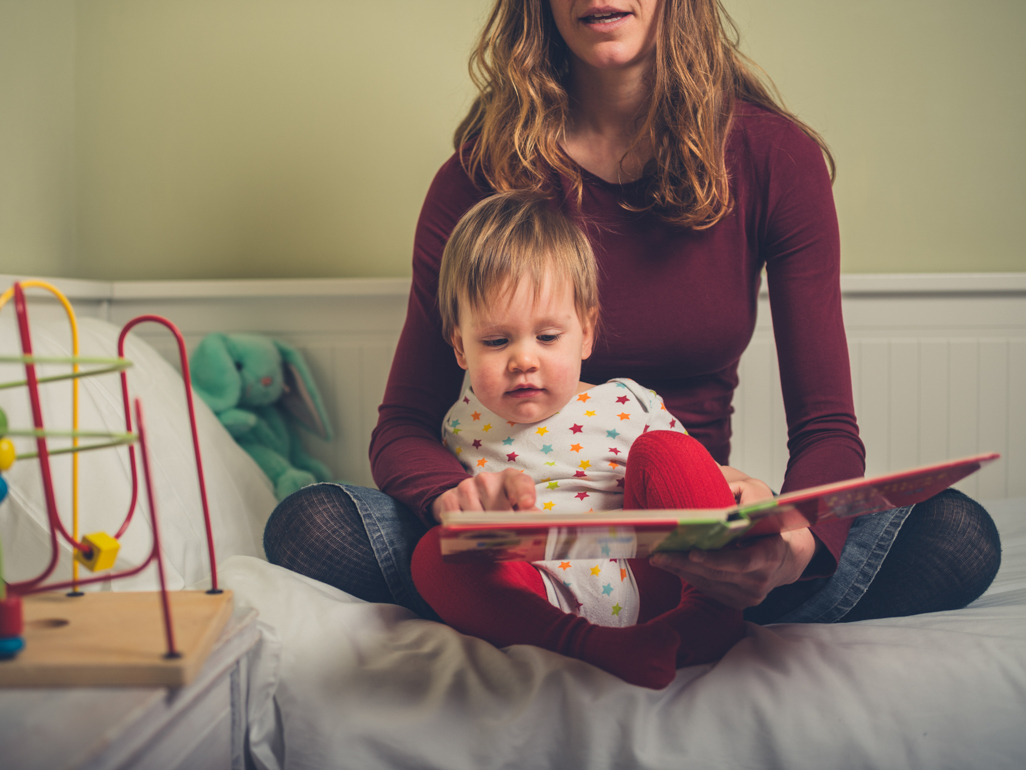 mother reading baby a story