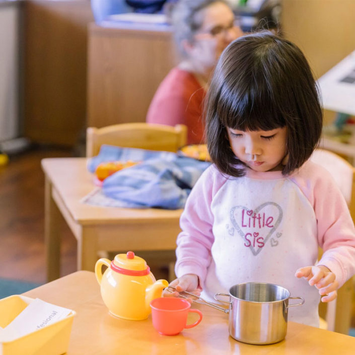 A person is eating at a table.