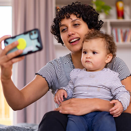 Gen Z Mom taking selfie with baby