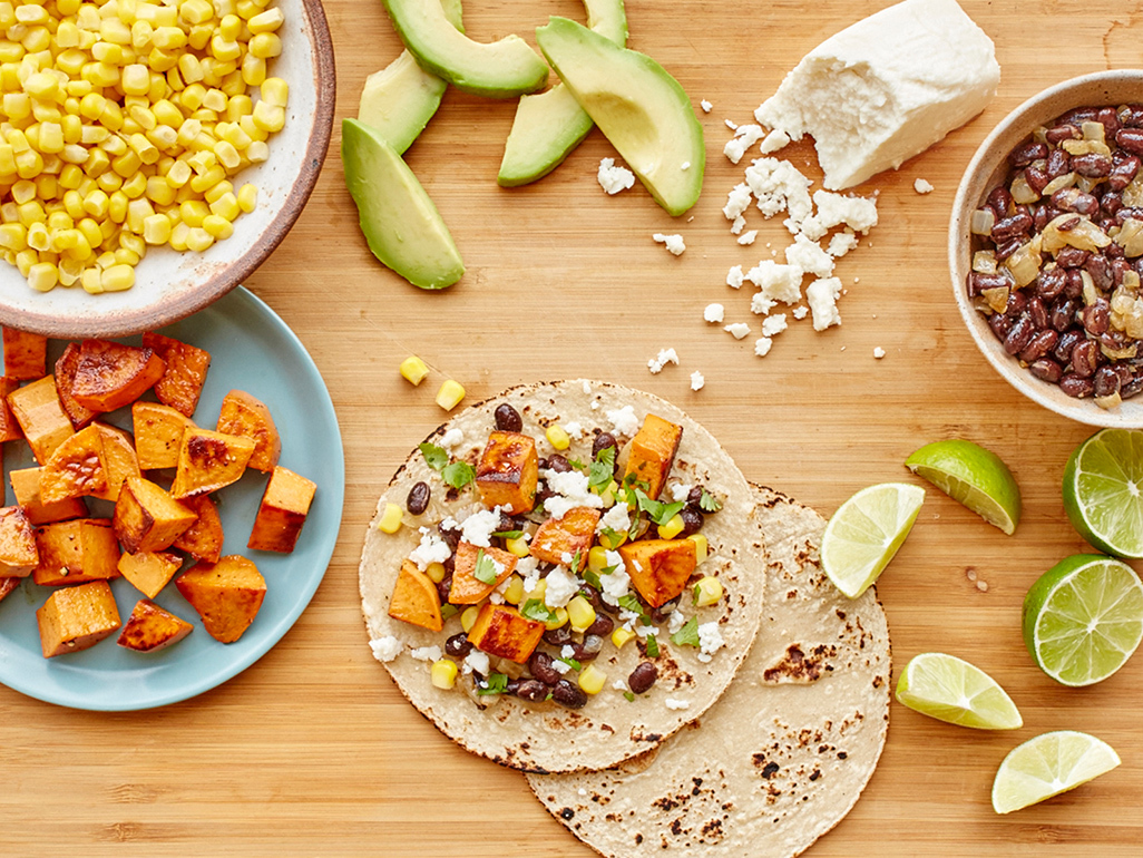 tortillas with avocado, corn, potato, cheese, beans and lime