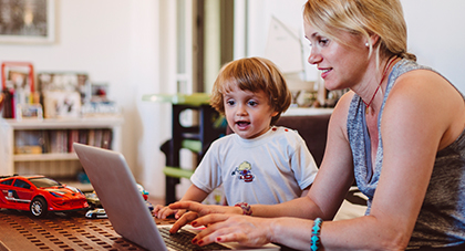 mother and son scheduling a medical appointment on a tablet device