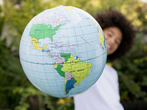 woman holding a globe