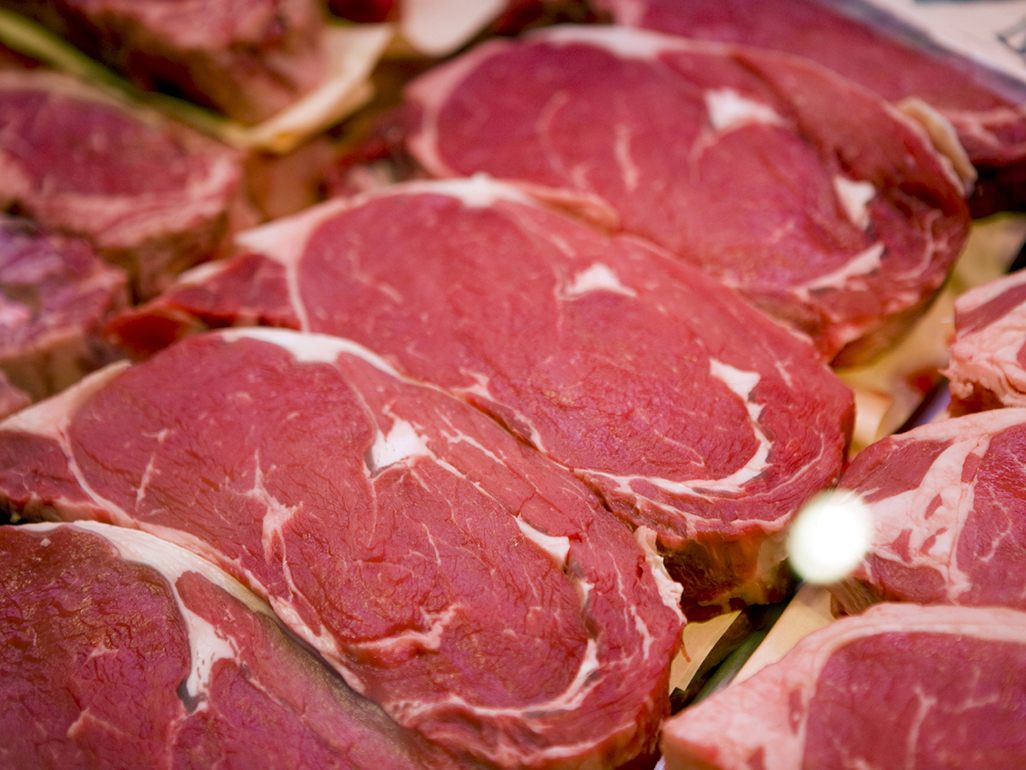 rows of raw rib-eye steak