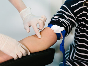 Nurse prepping to draw blood for test