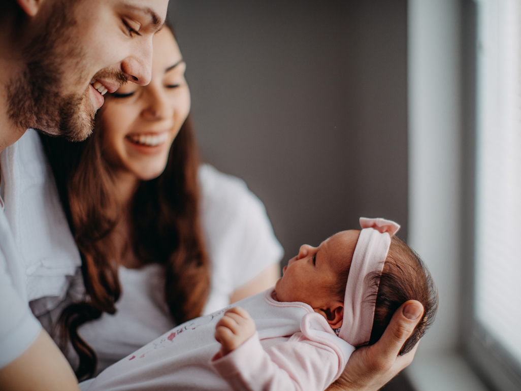 Parents holding a newborn