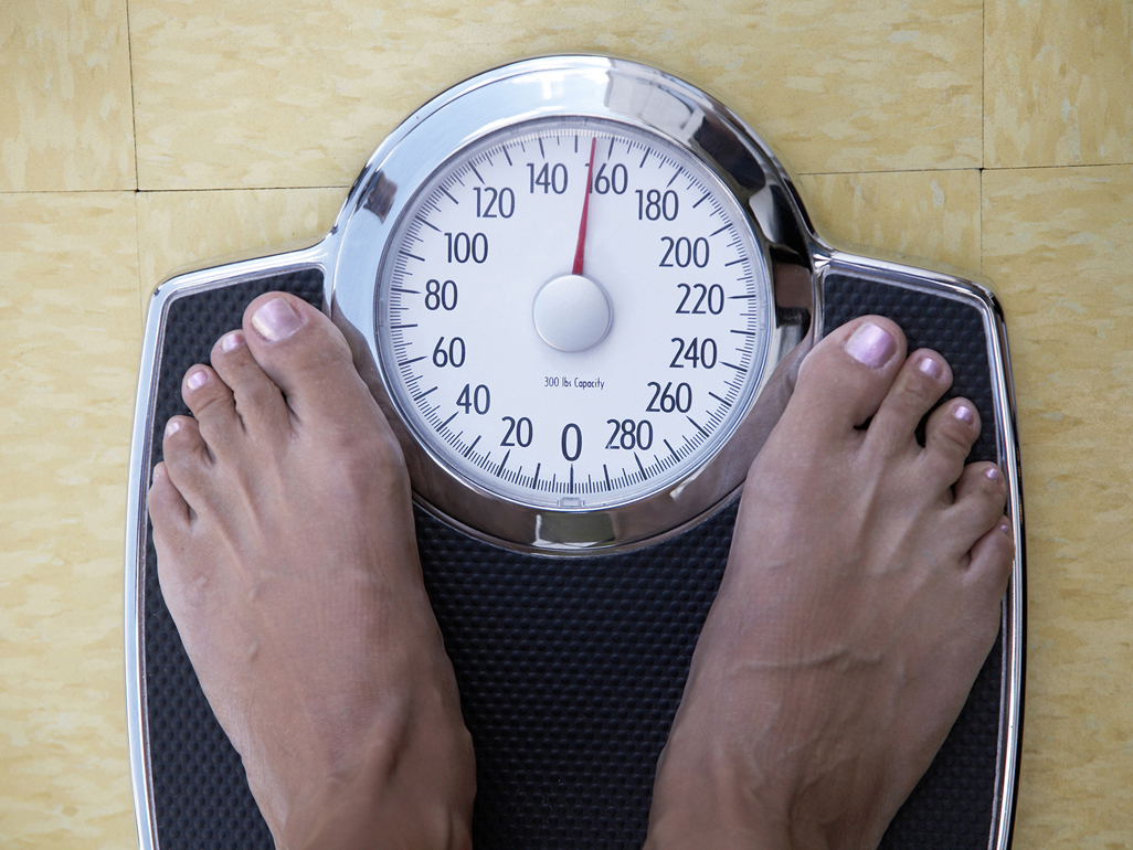 Woman being weighed