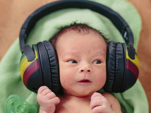 small baby with very big headphones