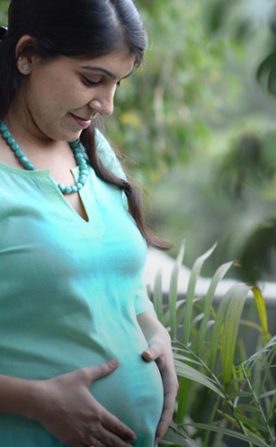 Woman looking at scan images of her fetus