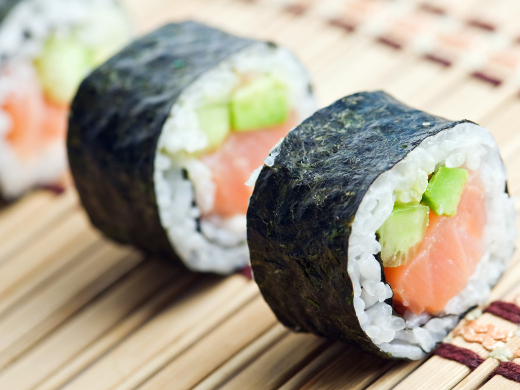 cut sushi rolls on a bamboo mat