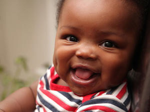 Close-up of a baby laughing