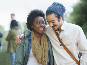 cute couple talking and smiling while hugging each other