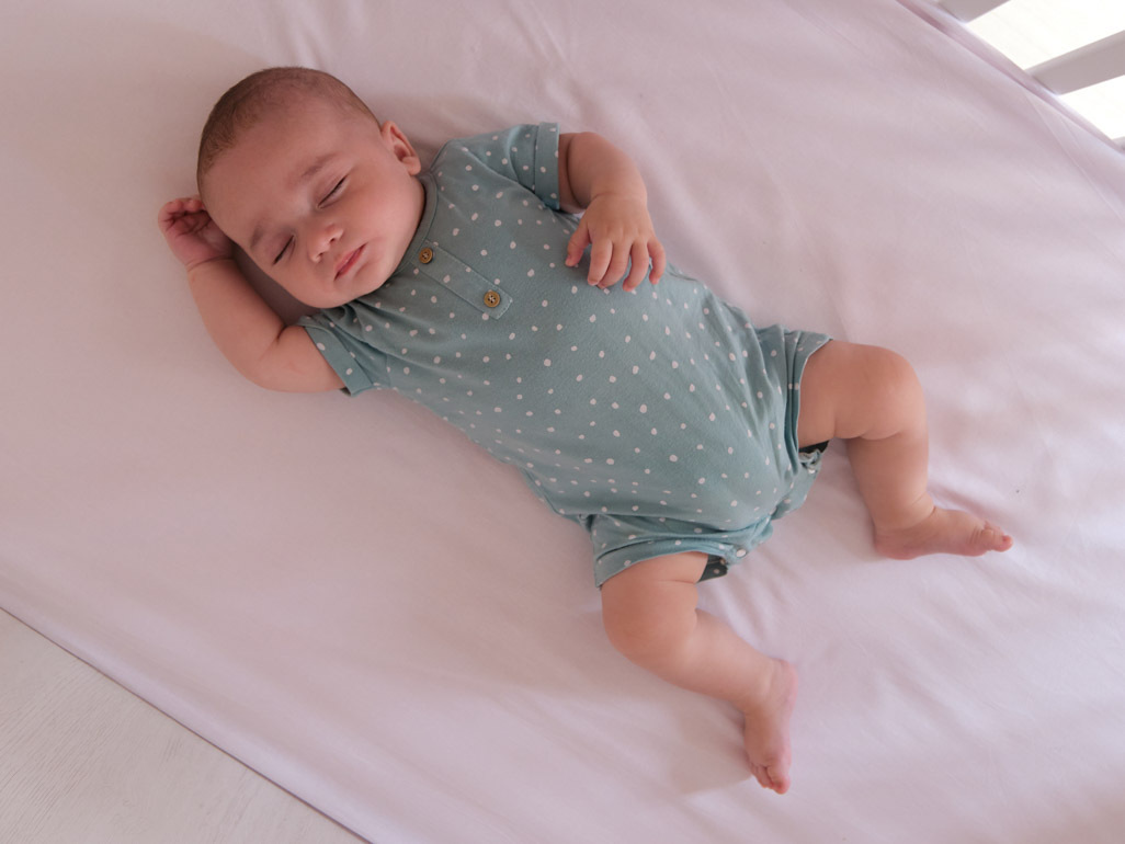 image of a baby sleeping with the text "BabyCenter Answers: Is it normal for my baby to snore?"