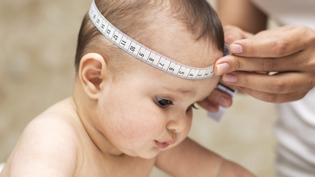 Baby getting her head measured