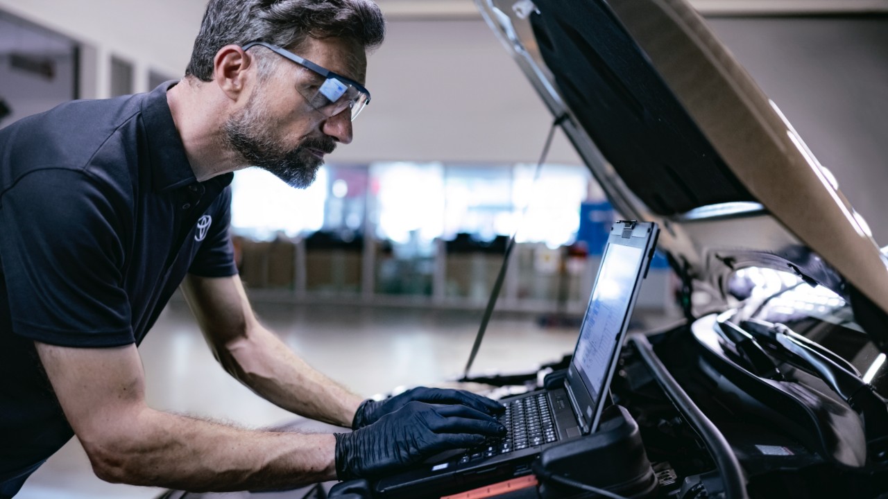 Toyota repairman on a car