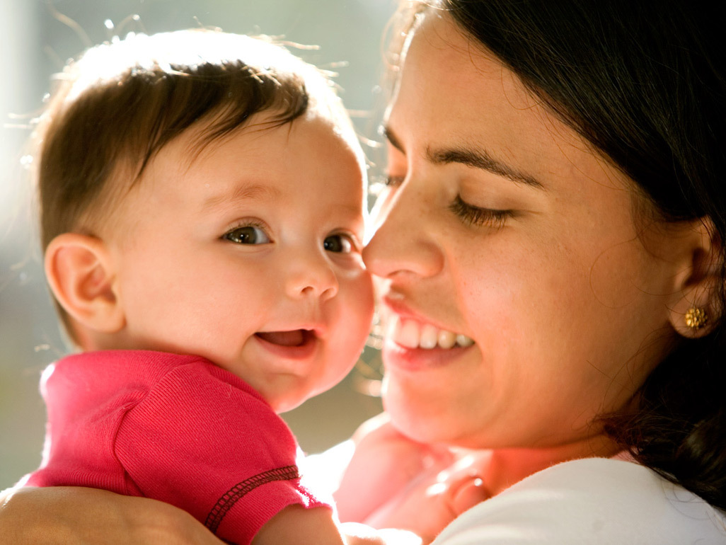 Mum and baby laughing