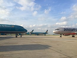 Planes on the tarmac, facing in different directions