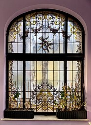 Rococo Revival festoon on a stained-glass window in the orangery of the Ecaterina Procopie House (Strada Bocșa no. 4), Bucharest, unknown architect or painter, c.1912[17]