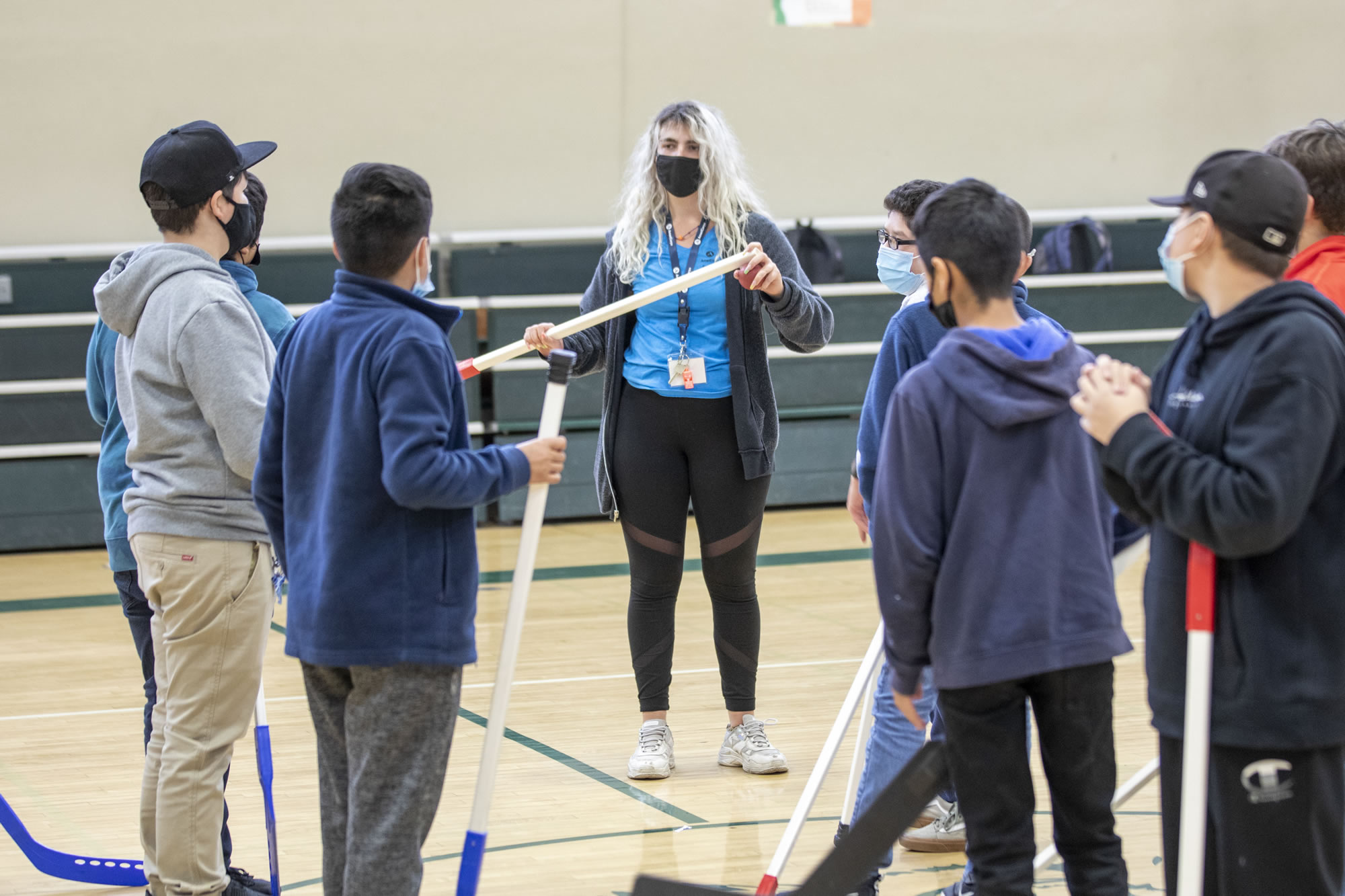 EXL Kids with Hockey Sticks