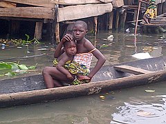 Makoko: A girl and her sister in a canoe