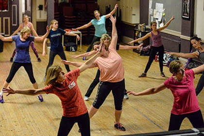 A group of women taking part in a health and exercise class.