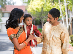 Happy family dressed in traditional garments