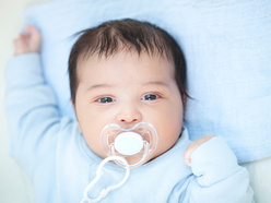 Baby using a soother