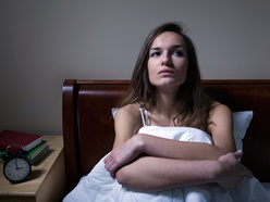 Lady sitting up in bed