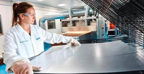 Female student working with steel