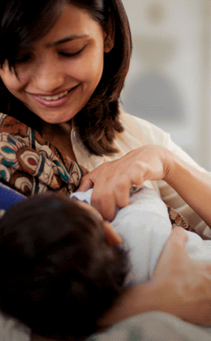 mom looking and speaking to her baby