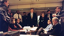 Photo of Clinton, his senior officials, and Biden on Air Force One