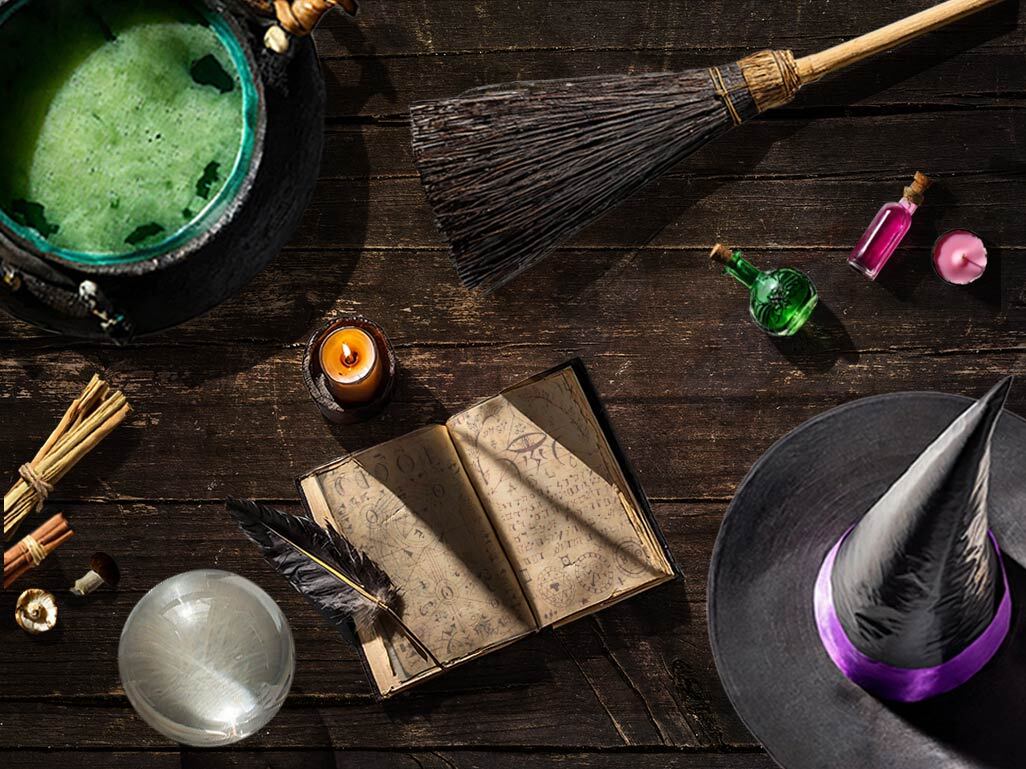 A collage of witchy paraphernalia, including a cauldron, hat, book, and potions