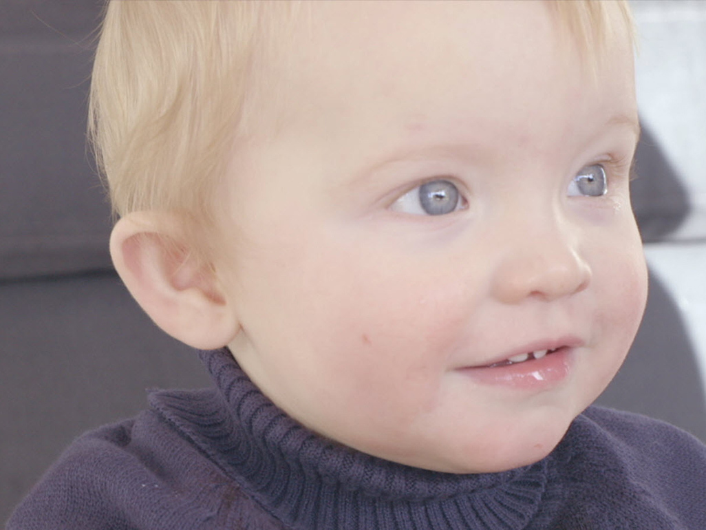 toddler in sweater