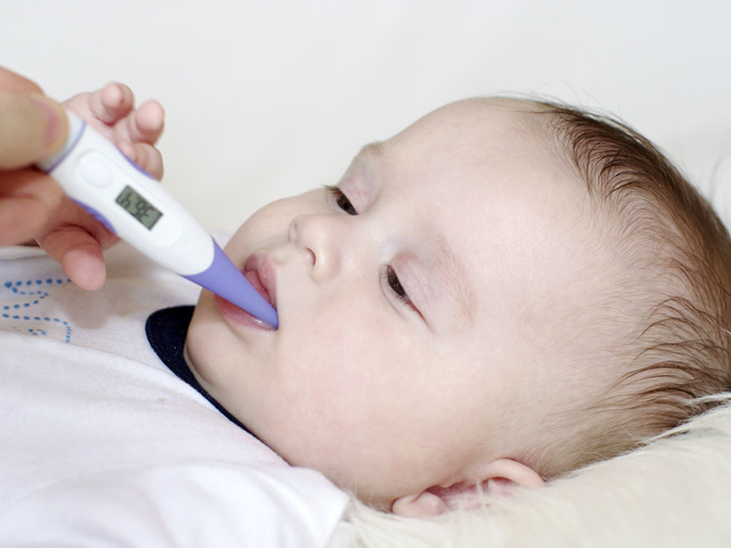 thermometer in baby's mouth