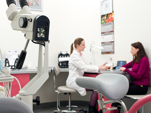 women sitting down and talking with her gynecologist