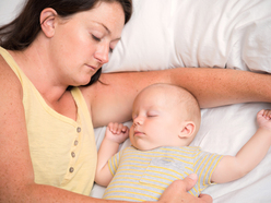 Mum and baby co-sleeping.