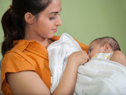 Mother and baby breastfeeding